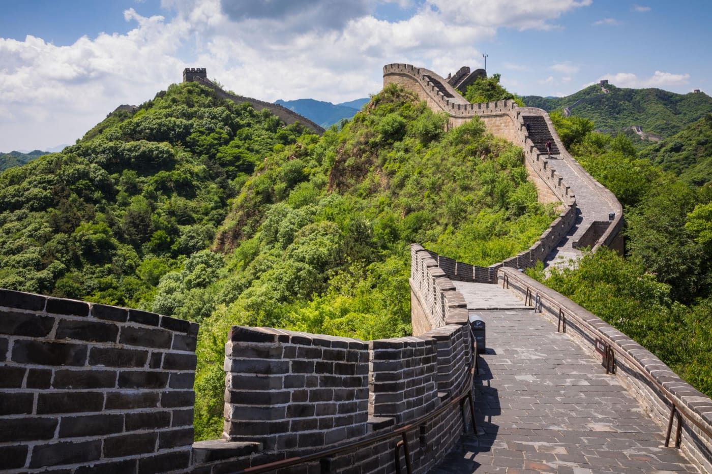 The Great Wall of China winding across green mountains near Beijing